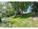 Expansive backyard featuring a lush lawn and mature trees, creating a private and serene outdoor space at 8315 Union Chapel Rd, Indianapolis, IN 46240