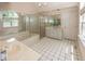 Luxurious bathroom featuring a soaking tub, glass shower, vanity, and tiled floor at 8315 Union Chapel Rd, Indianapolis, IN 46240