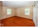 Bedroom featuring two windows, orange carpet and a closet at 8315 Union Chapel Rd, Indianapolis, IN 46240