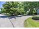 Long driveway with mature trees on a well-maintained lawn leading to the property at 8315 Union Chapel Rd, Indianapolis, IN 46240