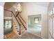 Foyer with staircase and view into the adjoining living room, creating an open atmosphere at 8315 Union Chapel Rd, Indianapolis, IN 46240