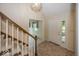 Inviting foyer featuring tile flooring, a staircase, and a front door with sidelight window at 8315 Union Chapel Rd, Indianapolis, IN 46240