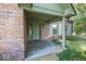 Charming brick home featuring a covered front porch and manicured landscaping at 8315 Union Chapel Rd, Indianapolis, IN 46240