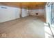 Spacious living room with a wood-paneled ceiling, fireplace, and sliding glass doors to outside at 8315 Union Chapel Rd, Indianapolis, IN 46240