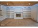 Cozy living room with built-in shelves and a brick fireplace, perfect for relaxing evenings at 8315 Union Chapel Rd, Indianapolis, IN 46240