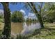Scenic river view surrounded by lush greenery and mature trees on a bright, sunny day at 8315 Union Chapel Rd, Indianapolis, IN 46240
