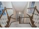 Elegant staircase featuring wooden railings and a stylish chandelier, adding to the interior appeal at 8315 Union Chapel Rd, Indianapolis, IN 46240
