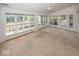 Bright sunroom with many windows, ideal for plant lovers, views of the water and backyard at 8315 Union Chapel Rd, Indianapolis, IN 46240
