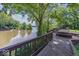 Scenic water view of the lake from the wooden deck of this beautiful home at 8315 Union Chapel Rd, Indianapolis, IN 46240