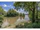 Scenic water view of the lake from the shoreline, near this beautiful home at 8315 Union Chapel Rd, Indianapolis, IN 46240
