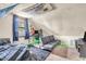 Bright attic bedroom features a futon, desk, and window for natural light, and themed decor at 850 Duane St, Franklin, IN 46131