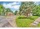 Charming home with detached garage and a large mature tree in the front yard at 850 Duane St, Franklin, IN 46131