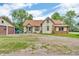 Quaint home with mature trees features a gravel driveway and detached garage to the left at 850 Duane St, Franklin, IN 46131