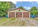 Spacious detached garage with three bays and traditional garage doors at 850 Duane St, Franklin, IN 46131