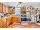 Functional kitchen featuring classic wood cabinetry, stainless steel appliances, and a ceiling fan at 850 Duane St, Franklin, IN 46131