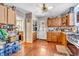 Kitchen showcasing wood cabinetry, practical layout, and connectivity to the adjacent living space at 850 Duane St, Franklin, IN 46131