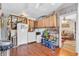 Spacious kitchen area with a laundry corner, wood-look flooring, and ample storage solutions at 850 Duane St, Franklin, IN 46131