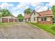 Property includes a detached garage, a spacious gravel driveway, and a well-maintained lawn at 850 Duane St, Franklin, IN 46131