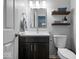 Modern bathroom features a sleek vanity, floating shelves, and contemporary fixtures at 8827 Lindsey Ct, Fishers, IN 46038
