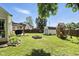 Well-maintained backyard featuring a pergola, storage shed, fire pit and playground at 8929 Sunburst Cir, Indianapolis, IN 46227