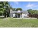This lovely backyard features a patio, grill, seating, and manicured lawn at 8929 Sunburst Cir, Indianapolis, IN 46227