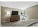 Inviting bedroom with dresser and workout equipment in a naturally lit setting at 8929 Sunburst Cir, Indianapolis, IN 46227