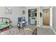 Playful bedroom featuring a play kitchen and a well-organized closet with clothing and toys at 8929 Sunburst Cir, Indianapolis, IN 46227