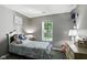 Bright bedroom featuring a window with a view and stylish decorations at 8929 Sunburst Cir, Indianapolis, IN 46227