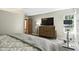Comfortable bedroom with soft lighting, a large dresser and exercise equipment at 8929 Sunburst Cir, Indianapolis, IN 46227