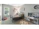 Cozy bedroom with window, playful decor, and toy kitchen set at 8929 Sunburst Cir, Indianapolis, IN 46227