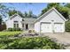 Charming single-Gathering home featuring a two-car garage, manicured lawn, and a cozy front porch at 8929 Sunburst Cir, Indianapolis, IN 46227