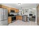 Charming kitchen with stainless steel appliances and adjacent living space at 8929 Sunburst Cir, Indianapolis, IN 46227