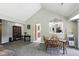 Spacious living area with dining table and view into kitchen at 8929 Sunburst Cir, Indianapolis, IN 46227