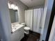 Bathroom featuring a shower with a white curtain, new toilet and a single sink vanity at 952 Delray Dr, Indianapolis, IN 46241