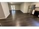 Open floor plan with the living room to the left and the kitchen with stainless appliances to the right at 952 Delray Dr, Indianapolis, IN 46241