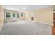 Basement featuring carpet flooring with a view of a door to the outside and a bathroom at 1008 Westcreek Dr, Columbus, IN 47201