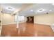 Finished basement with laminate flooring, home theater area with large screen at 1008 Westcreek Dr, Columbus, IN 47201