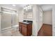 Bathroom featuring a shower, sink, and wooden vanity at 1008 Westcreek Dr, Columbus, IN 47201