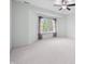 Light and airy bedroom with neutral carpet, ceiling fan, and large windows with purple curtains at 1008 Westcreek Dr, Columbus, IN 47201