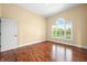 Bedroom with wood floors, natural light, and white trim at 1008 Westcreek Dr, Columbus, IN 47201
