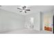Bright bedroom with neutral carpet, ceiling fan, and view into the bathroom and another room at 1008 Westcreek Dr, Columbus, IN 47201