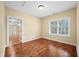 Bright bedroom boasts hardwood floors, light tan walls, and large window allowing for plenty of natural light at 1008 Westcreek Dr, Columbus, IN 47201