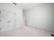 Neutral bedroom features a carpet, white base trim and closet with double doors at 1008 Westcreek Dr, Columbus, IN 47201