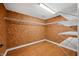 Walk-in closet with shelves and wooden floors at 1008 Westcreek Dr, Columbus, IN 47201