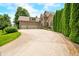 Well-maintained two-story home featuring a brick facade, a three-car garage, and a concrete driveway at 1008 Westcreek Dr, Columbus, IN 47201