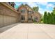 Welcoming brick home with an attached garage, tidy landscaping, and a neatly paved driveway at 1008 Westcreek Dr, Columbus, IN 47201
