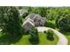 Beautiful brick home with a spacious driveway and mature trees creating a serene, private setting at 1008 Westcreek Dr, Columbus, IN 47201