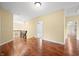 Spacious hallway with hardwood flooring, iron railing and natural light at 1008 Westcreek Dr, Columbus, IN 47201