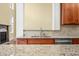 Kitchen features granite countertops, modern stainless steel appliances, and wood cabinetry at 1008 Westcreek Dr, Columbus, IN 47201