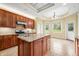 An eat-in kitchen features granite counters, stainless appliances, and generous cabinet space at 1008 Westcreek Dr, Columbus, IN 47201